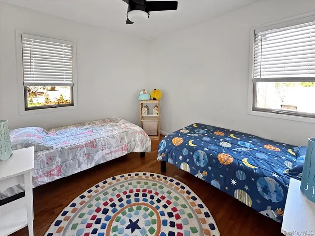 a bedroom with bed and a window