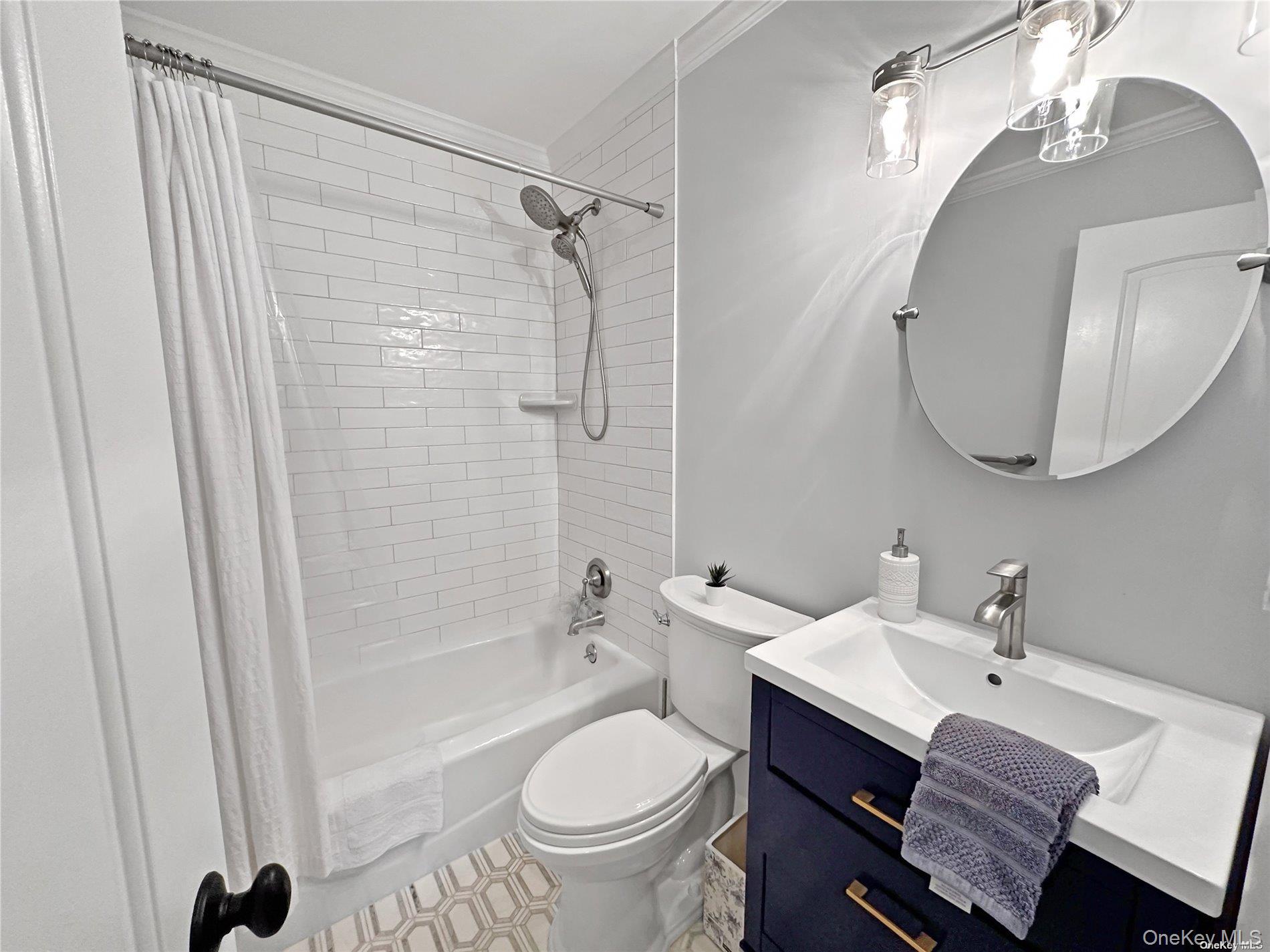 126 Overhill Road Wading River, NY 11792 - Photo 9 of 23 a bathroom with a sink toilet a mirror and shower