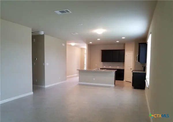 a view of house with backyard