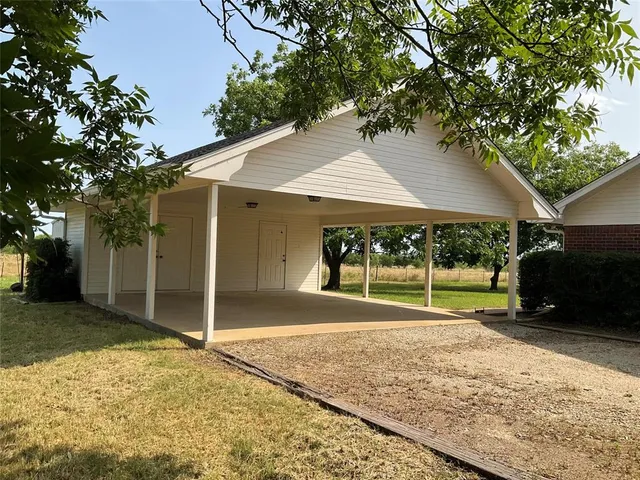 a view of a backyard of the house