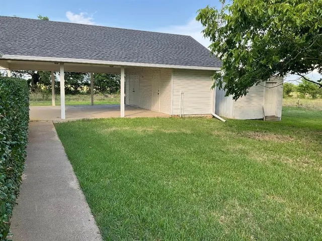 a view of a house with a garden