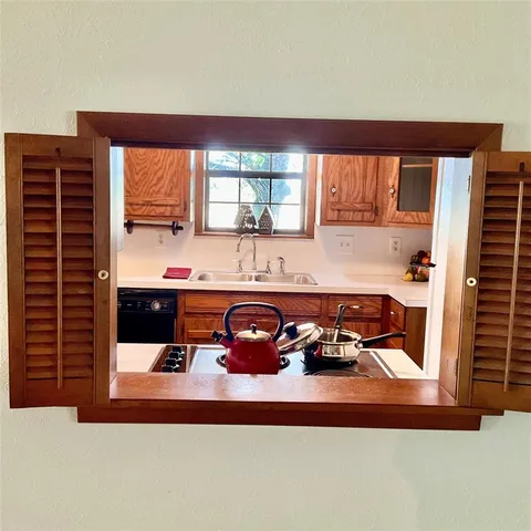 a kitchen with a wooden floor and a stove