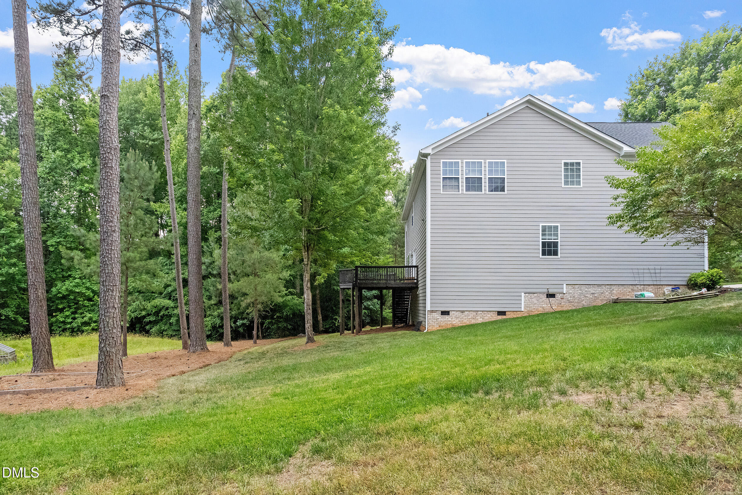 1019 Bianco Drive Raleigh, NC 27607 - Photo 24 of 29 a view of a house with backyard and garden