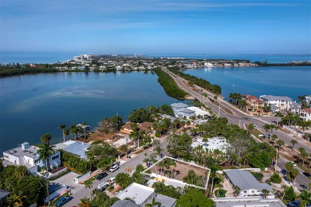 an aerial view of a city with ocean view