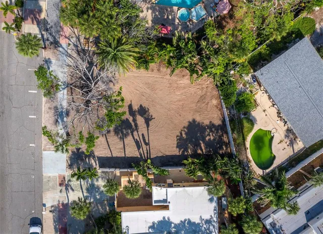 an aerial view of a house with a yard and garden