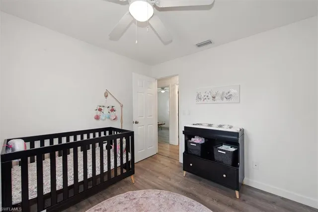 a bedroom with furniture and a fireplace