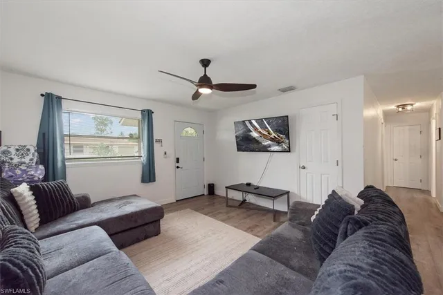 a living room with furniture and a window