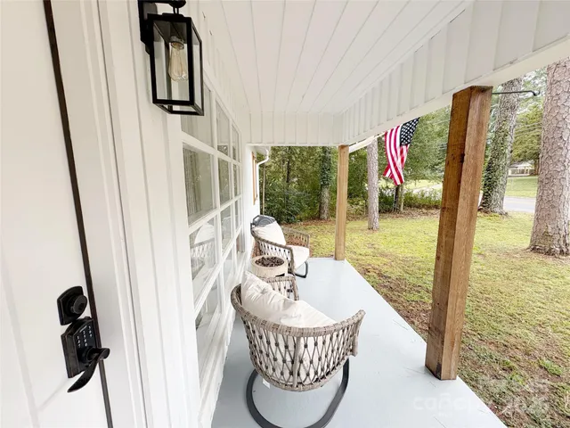 a view of a balcony with furniture