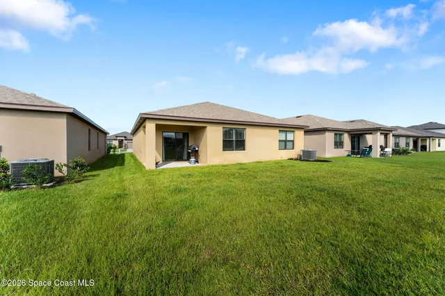 a view of a swimming pool with a yard