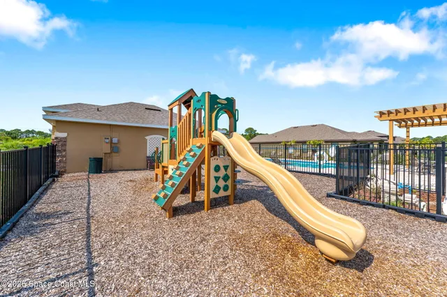 a view of swimming pool with a yard