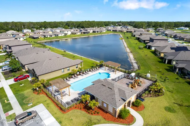 an aerial view of a house with a garden