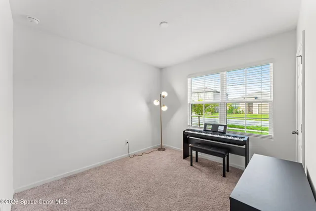 a room with furniture and a window