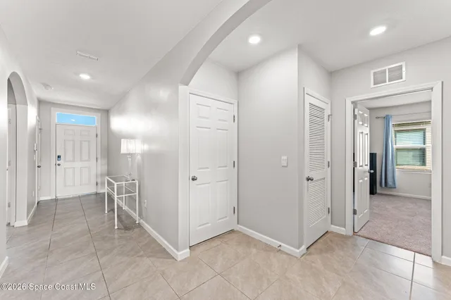 a view of a hallway with closet area