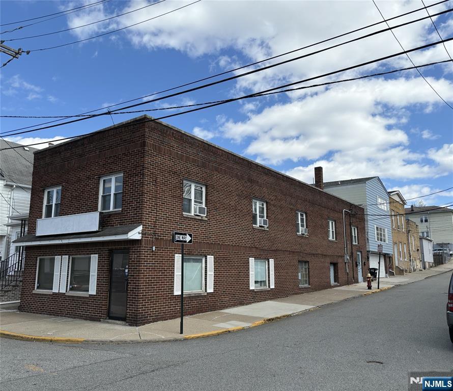 a front view of a building with a street
