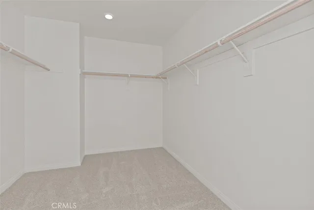 a spacious bathroom with double sink and shower