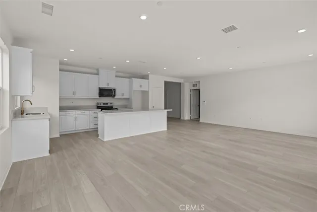 a view of kitchen with wooden floor