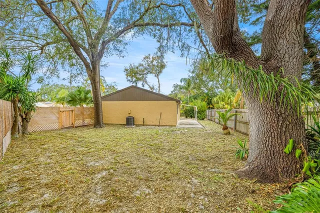 a house with a trees in front of it