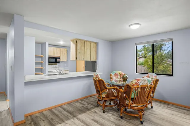 a dining room with furniture and window