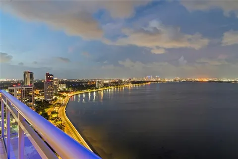 a view of a lake from a balcony