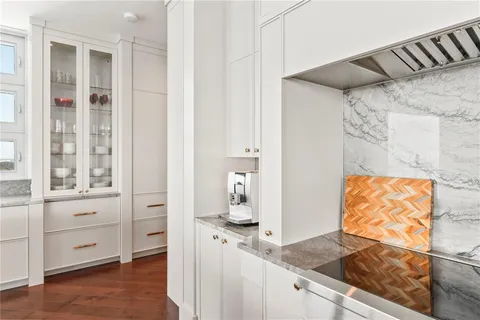 a living room with couch and a floor to ceiling window