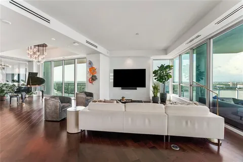 a bathroom with a sink mirror and a shower