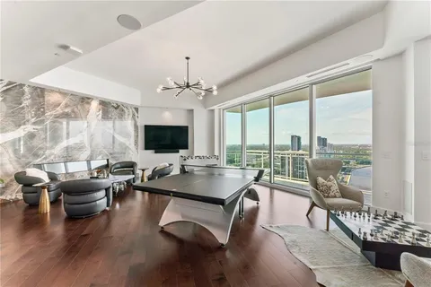 a view of a kitchen with a refrigerator and a sink
