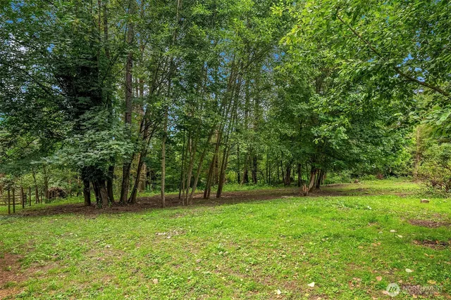 a view of outdoor space with deck and yard