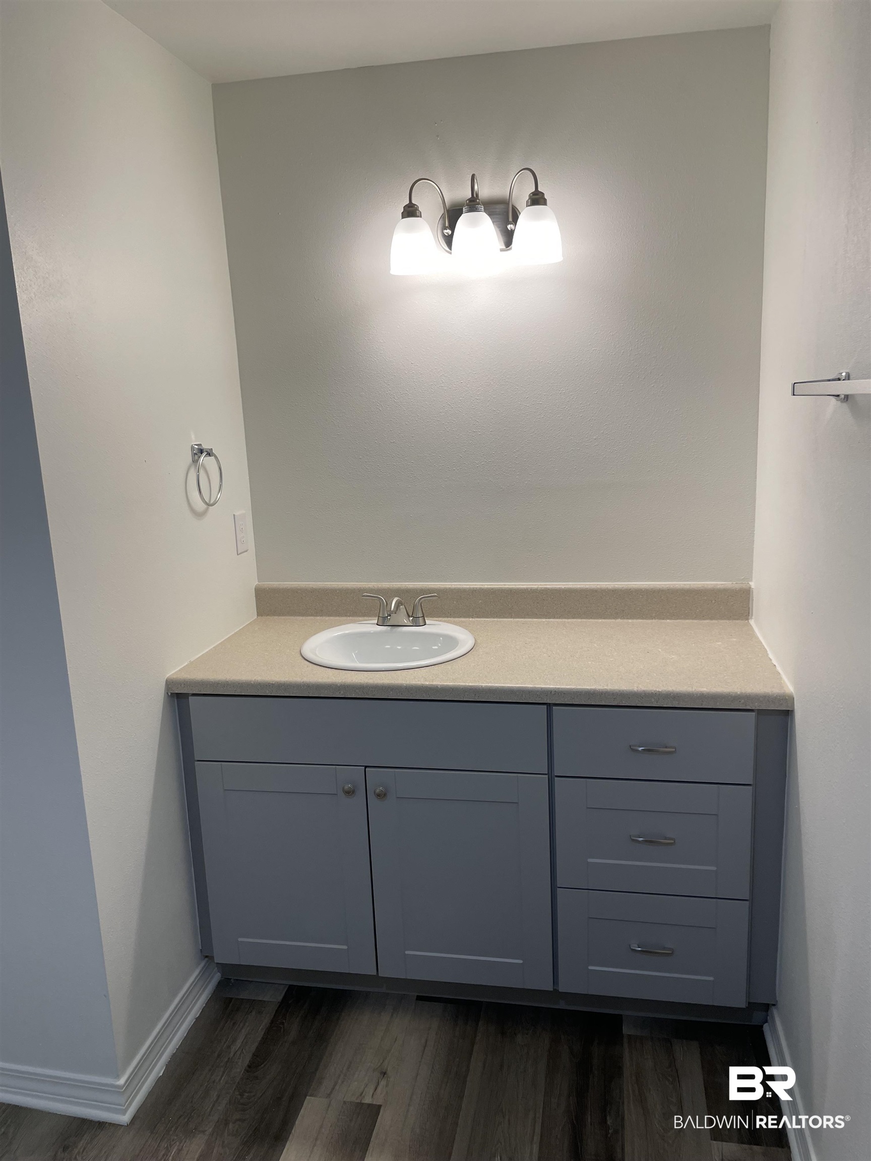 2 Canterberry Circle Foley, AL 36535 - Photo 6 of 24 Bathroom with baseboards, wood finished floors, and vanity