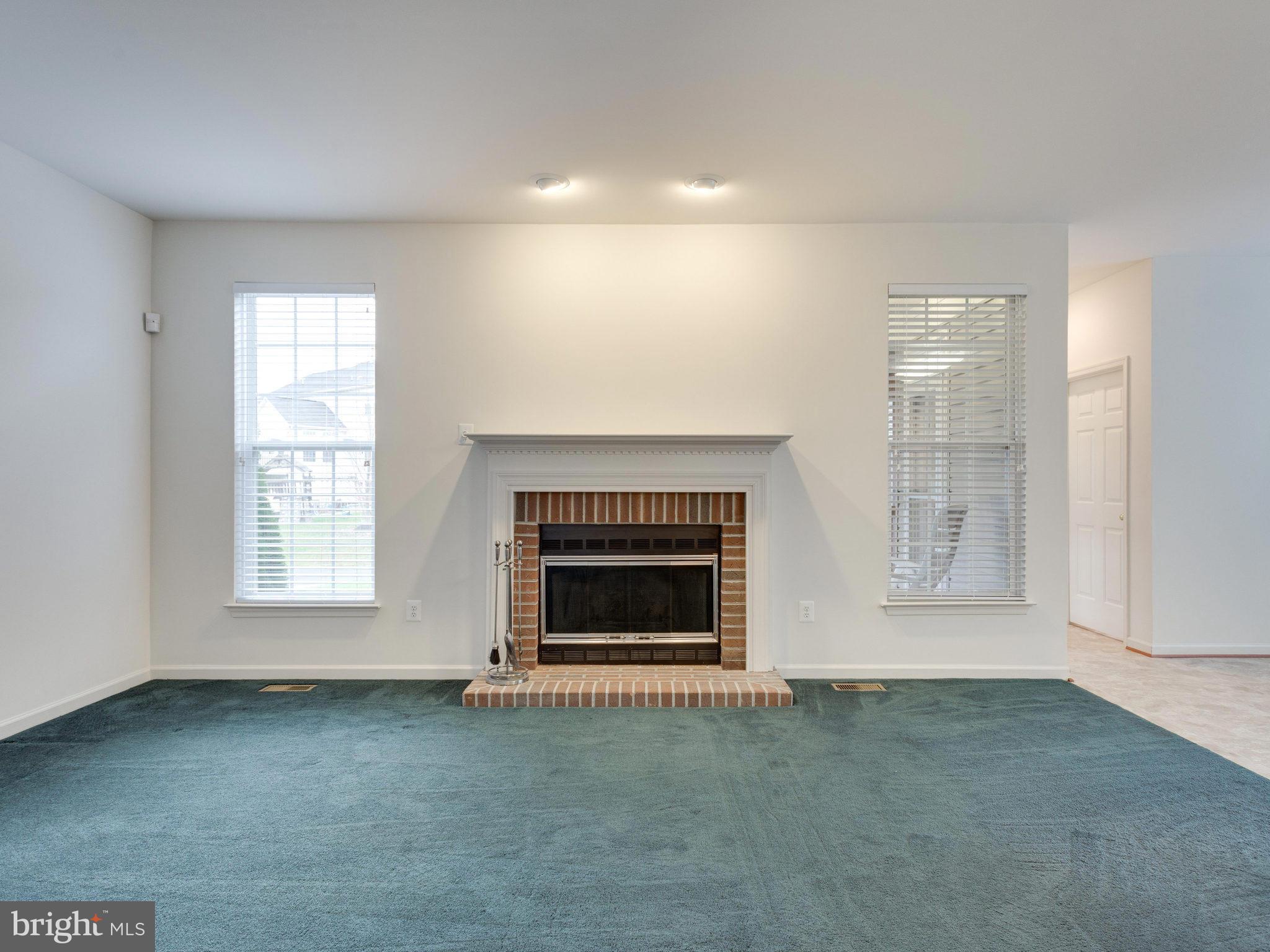 18411 Thundercloud Road Boyds, MD 20841 - Photo 12 of 30 a living room with a fireplace