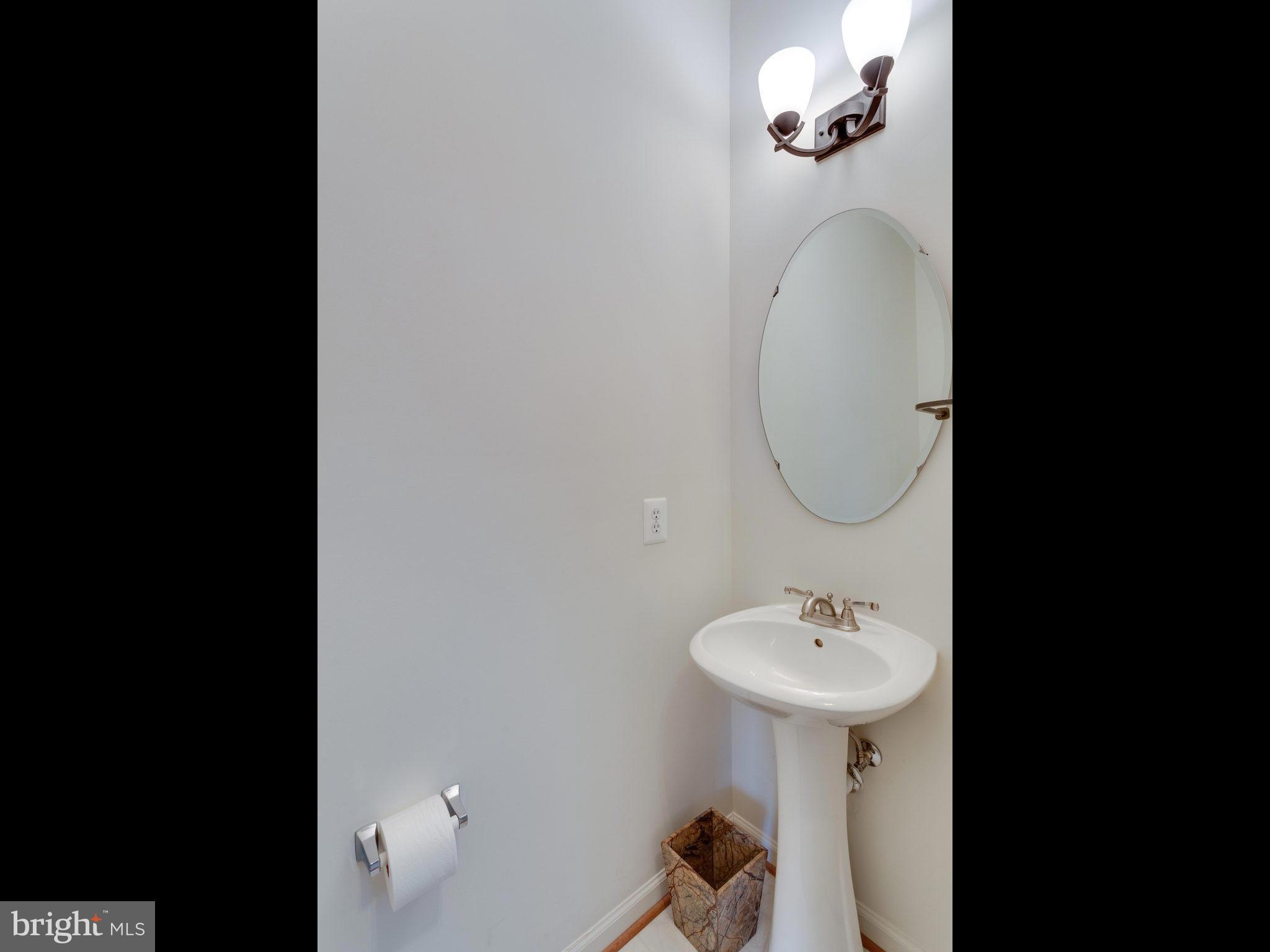18411 Thundercloud Road Boyds, MD 20841 - Photo 14 of 30 a bathroom with a sink and a mirror