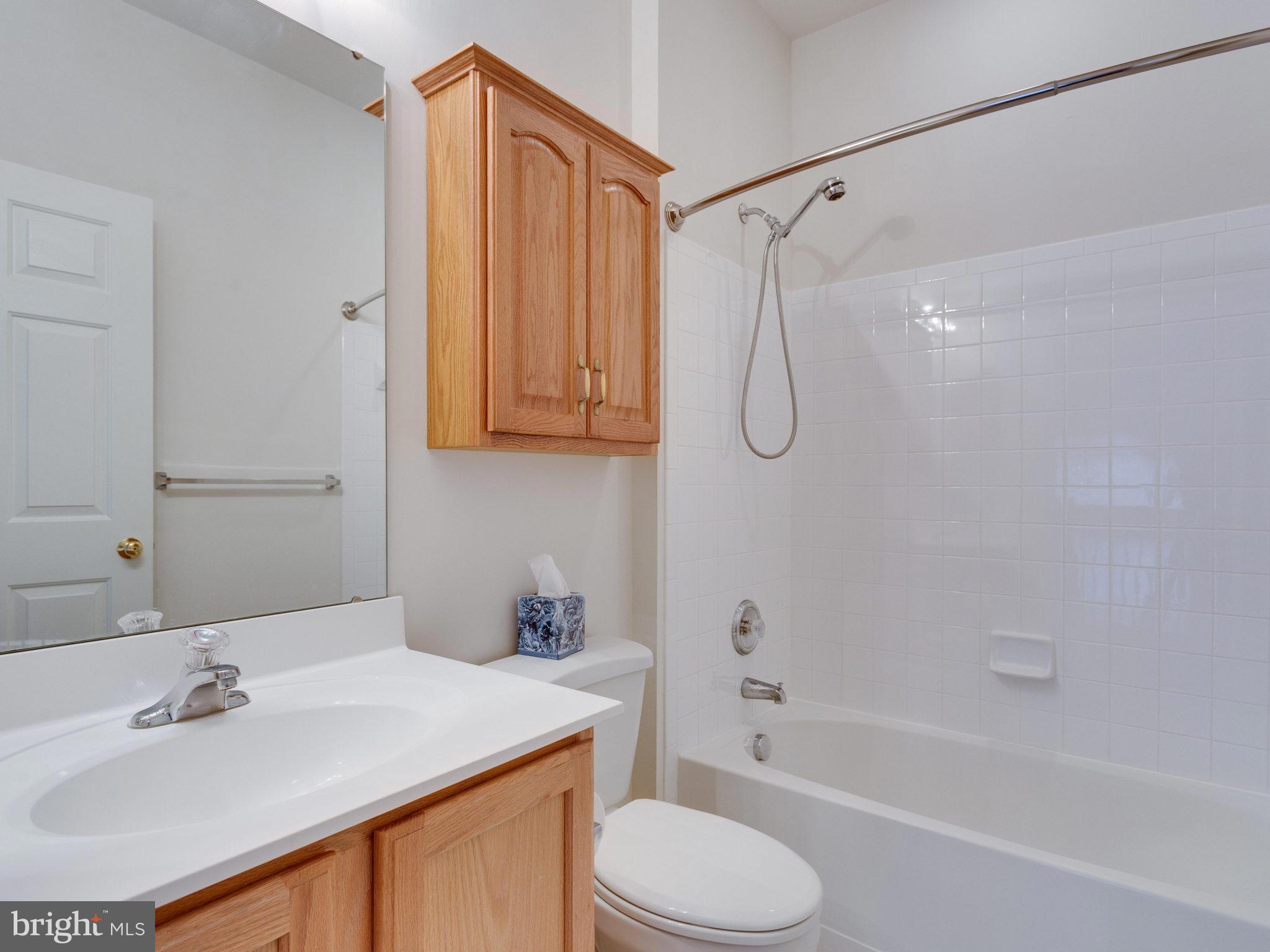 18411 Thundercloud Road Boyds, MD 20841 - Photo 21 of 30 a bathroom with a sink toilet and shower