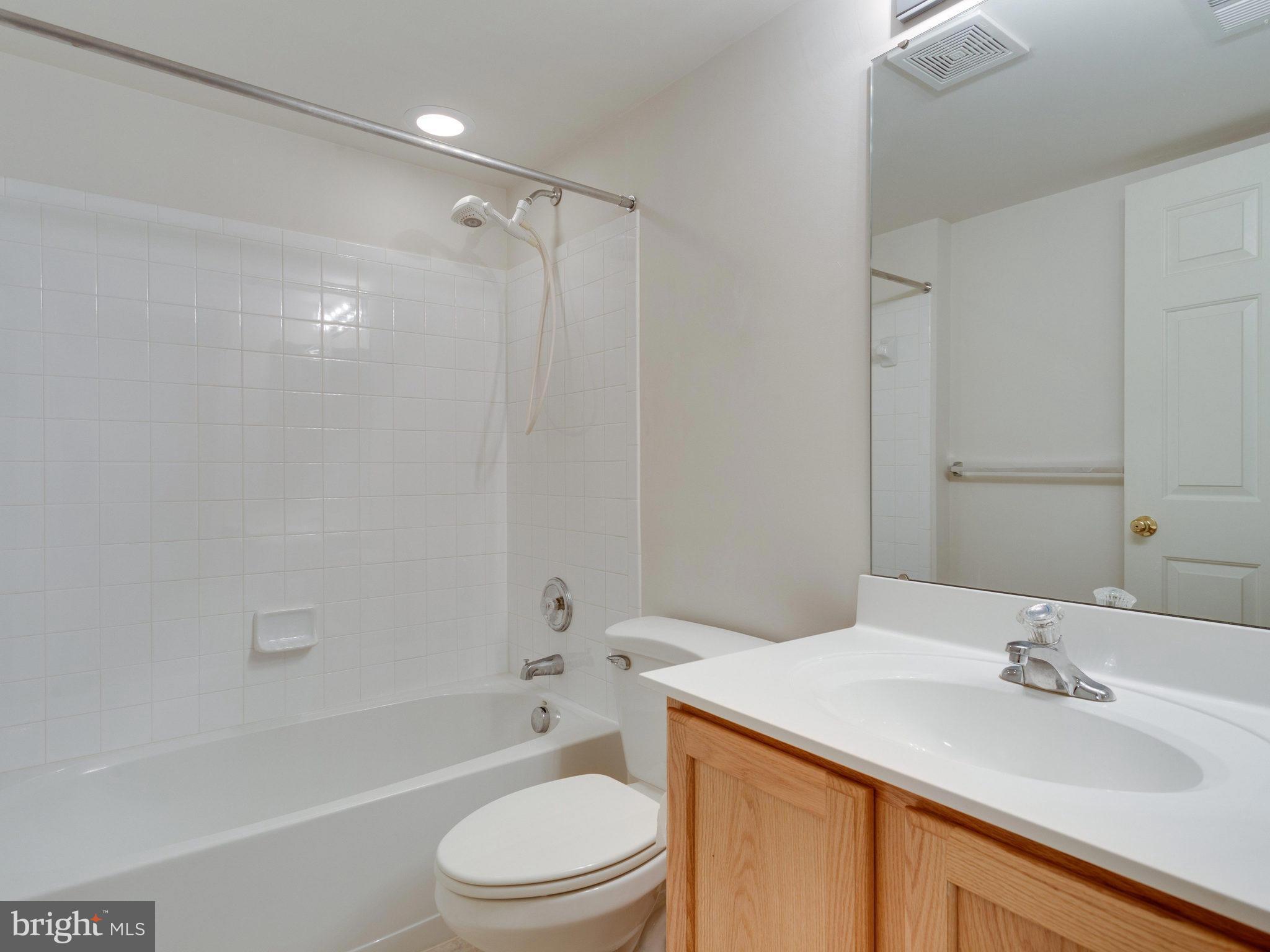 18411 Thundercloud Road Boyds, MD 20841 - Photo 24 of 30 a bathroom with a sink a toilet and shower