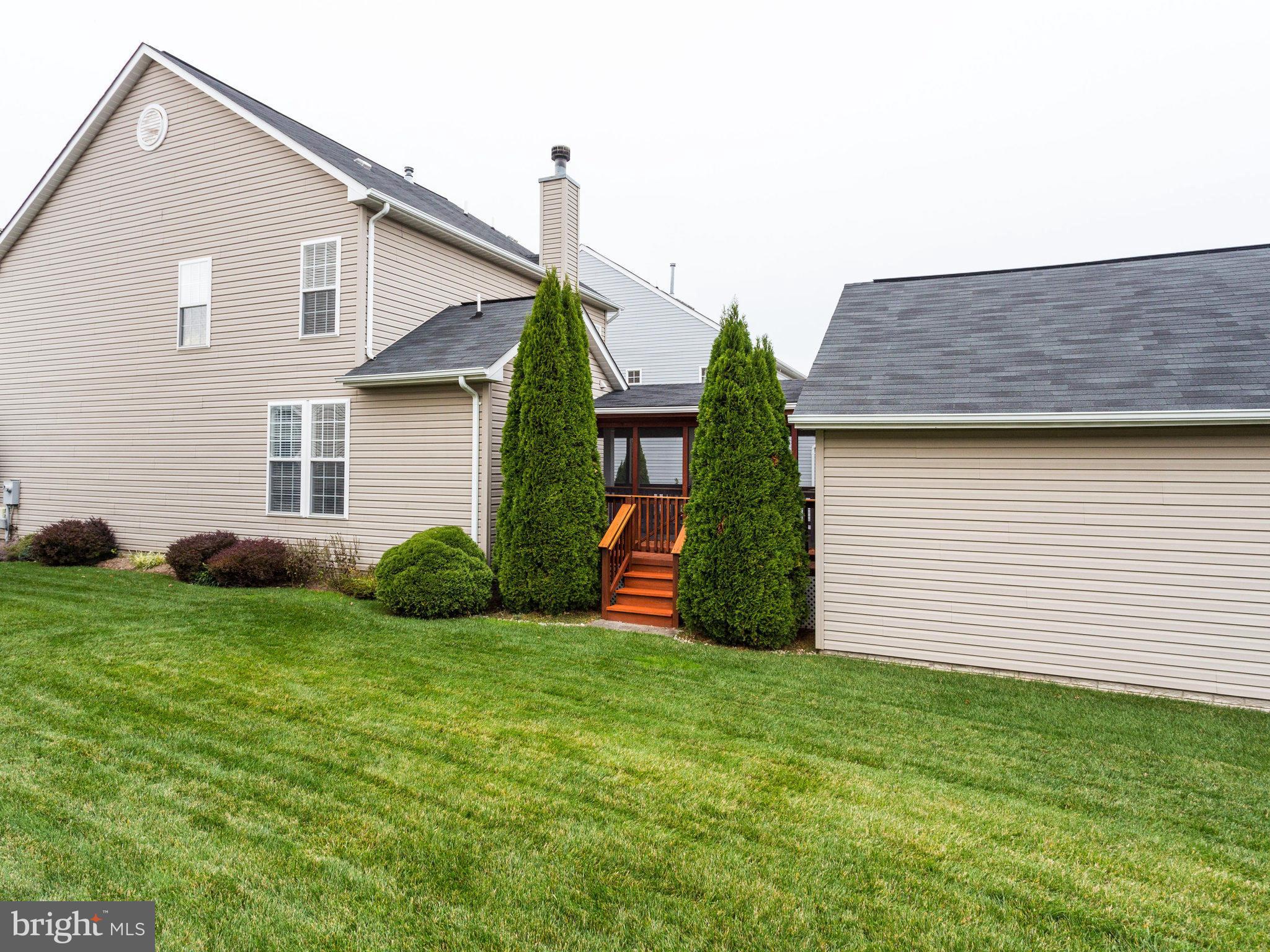 18411 Thundercloud Road Boyds, MD 20841 - Photo 28 of 30 a view of a backyard with plants and large tree