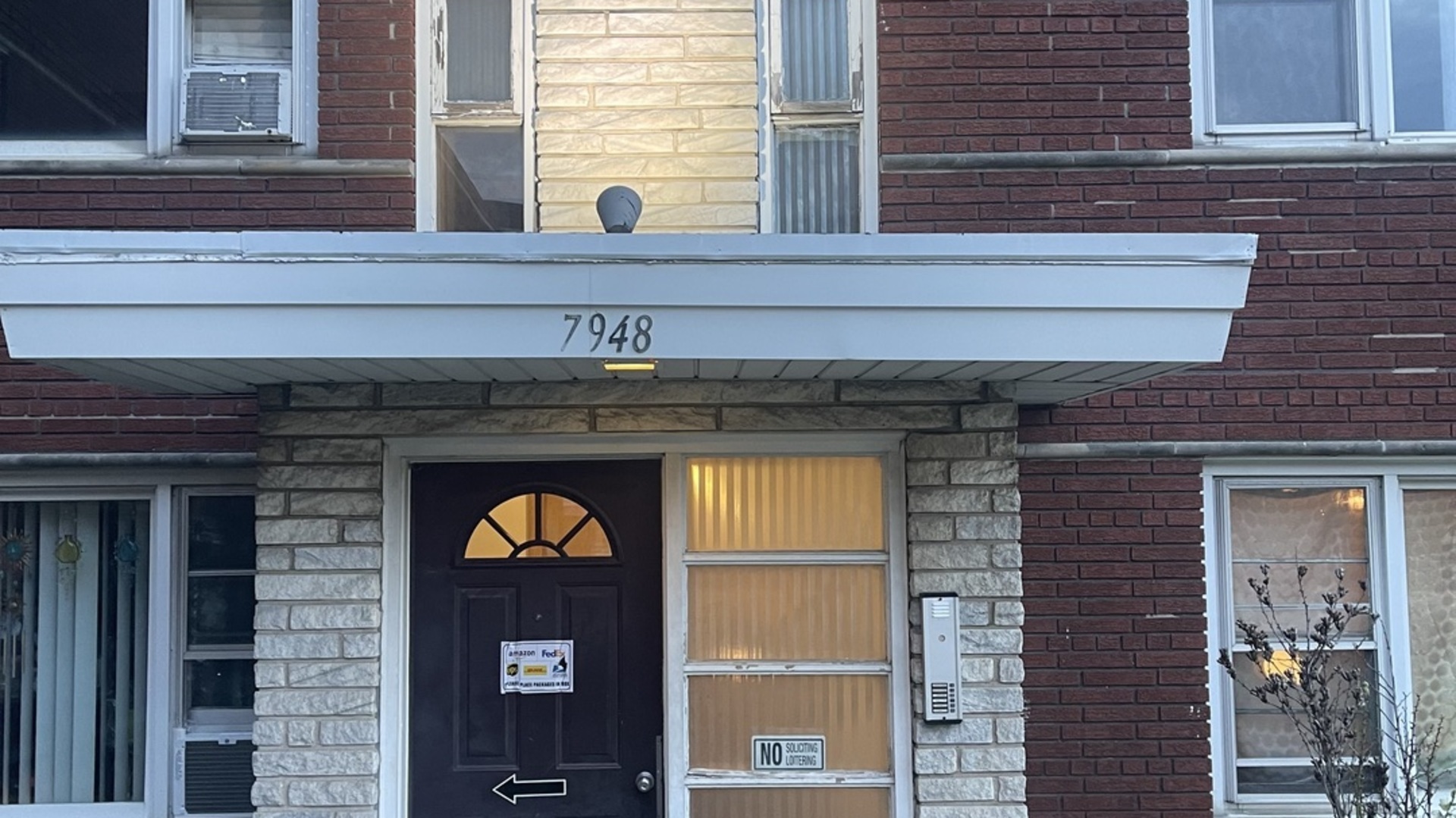 7948 South Pulaski Road, Unit 201 Chicago, IL 60652 - Photo 2 of 9 a view of a brick house with front door