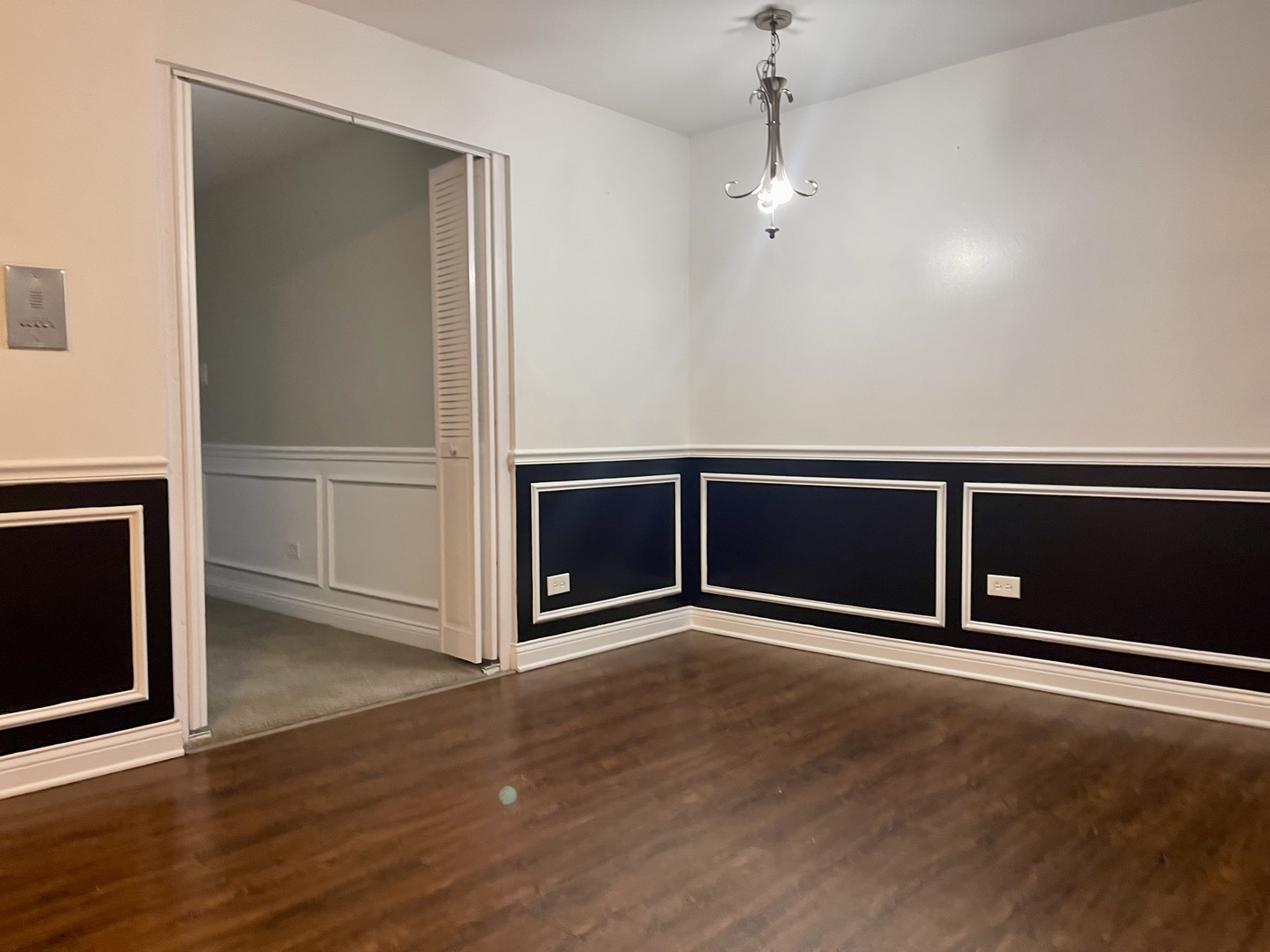 7948 South Pulaski Road, Unit 201 Chicago, IL 60652 - Photo 7 of 9 an empty room with wooden floor and cabinet