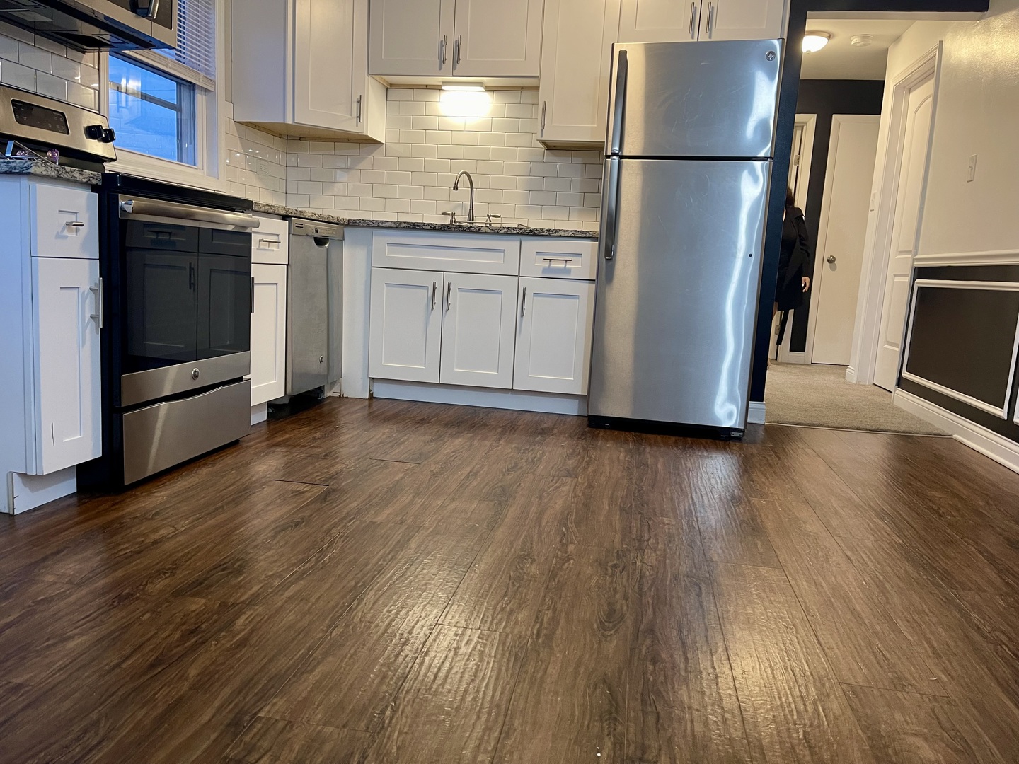 7948 South Pulaski Road, Unit 201 Chicago, IL 60652 - Photo 8 of 9 a kitchen with stainless steel appliances a refrigerator and wooden floor