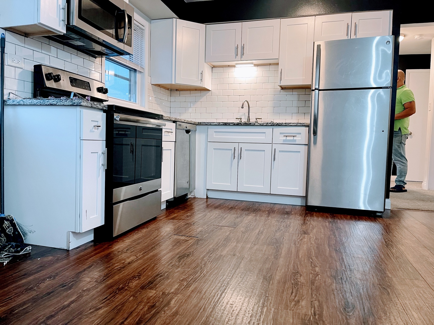 7948 South Pulaski Road, Unit 201 Chicago, IL 60652 - Photo 9 of 9 a kitchen with stainless steel appliances granite countertop a refrigerator sink and white cabinets