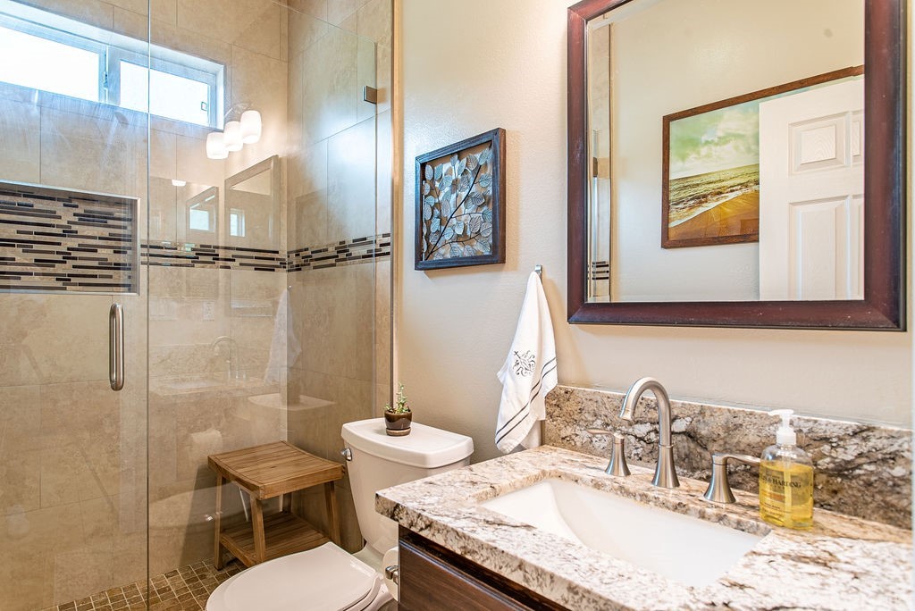 25054 Oliver Way Stevenson Ranch, CA 91381 - Photo 20 of 53 a bathroom with a granite countertop toilet sink and mirror