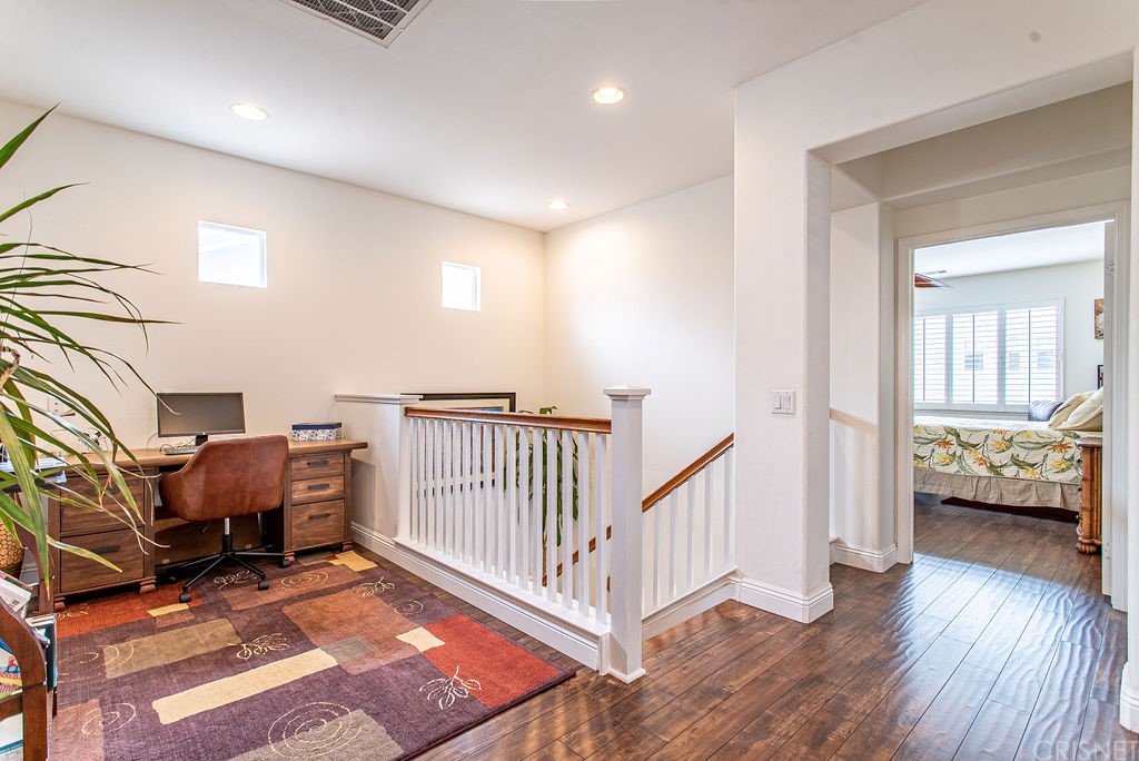 25054 Oliver Way Stevenson Ranch, CA 91381 - Photo 24 of 53 a view of room with furniture and wooden floor