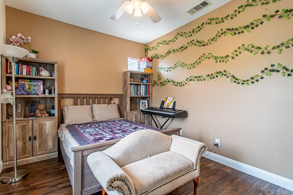 25054 Oliver Way Stevenson Ranch, CA 91381 - Photo 32 of 53 a living room with a couch and a table