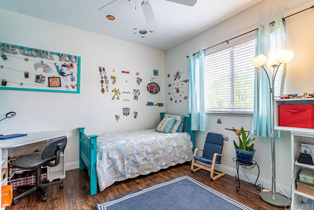 25054 Oliver Way Stevenson Ranch, CA 91381 - Photo 33 of 53 a bedroom with furniture and a window