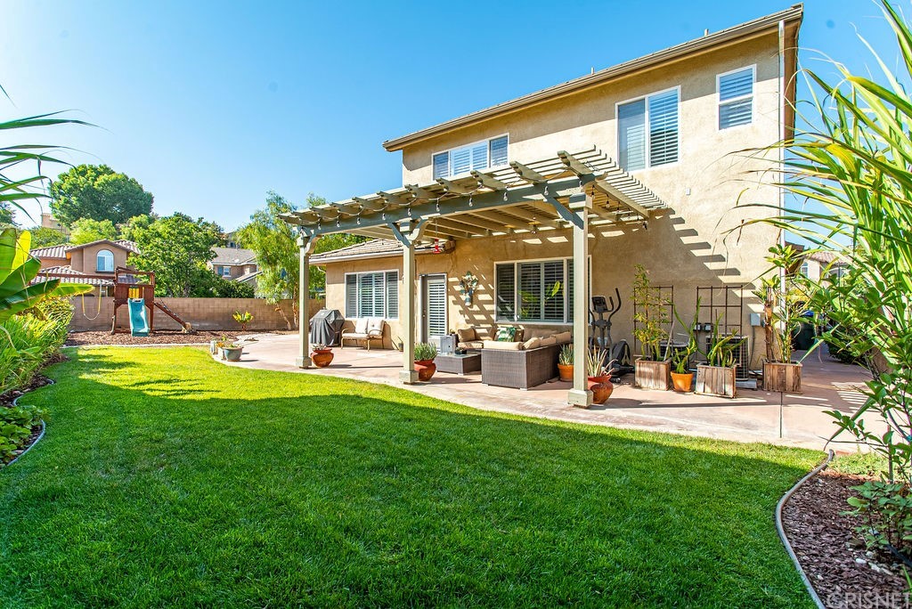 25054 Oliver Way Stevenson Ranch, CA 91381 - Photo 37 of 53 a view of a house with a yard and sitting area