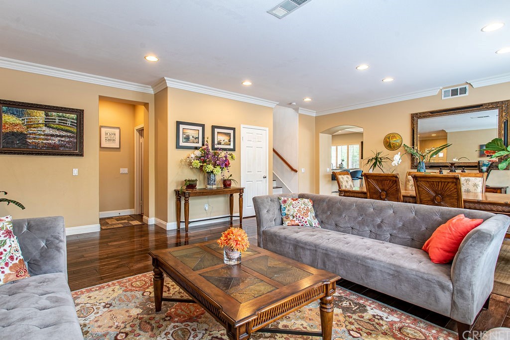 25054 Oliver Way Stevenson Ranch, CA 91381 - Photo 6 of 53 a living room with furniture and wooden floor