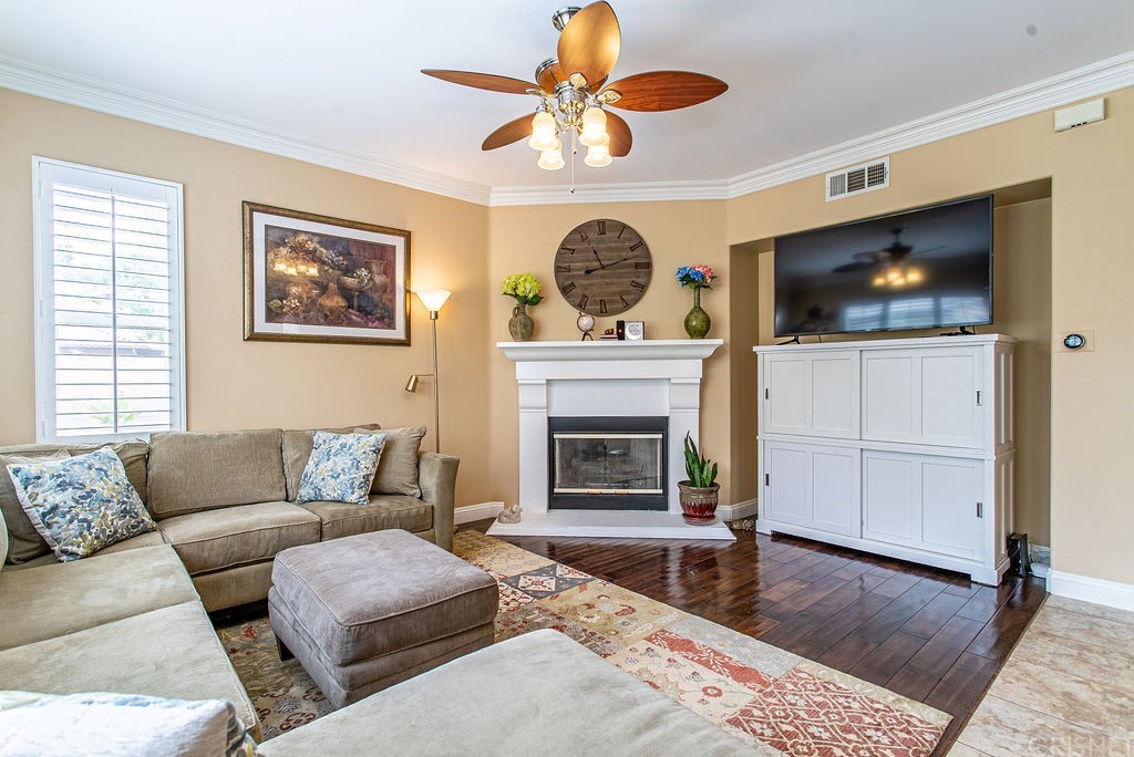 25054 Oliver Way Stevenson Ranch, CA 91381 - Photo 10 of 53 a living room with furniture and a fireplace