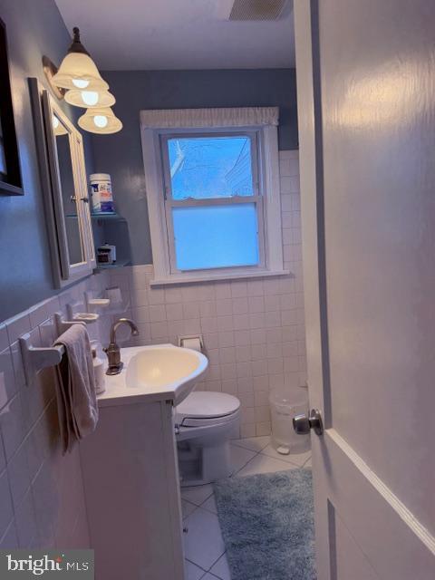 2511 Lindell Street Silver Spring, MD 20902 - Photo 14 of 21 a bathroom with a toilet sink and mirror