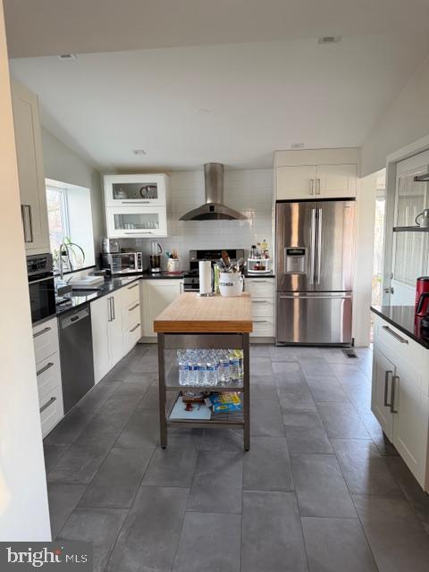 2511 Lindell Street Silver Spring, MD 20902 - Photo 5 of 21 a kitchen with refrigerator and cabinets