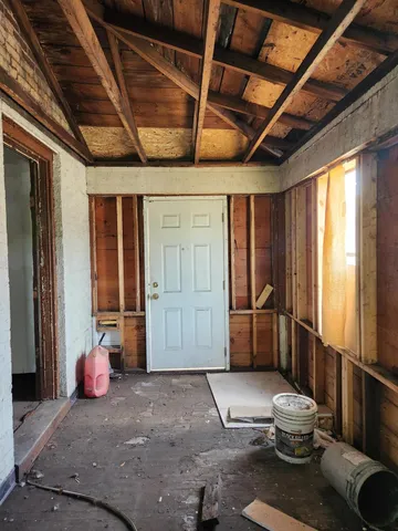 a living room with furniture and a shower