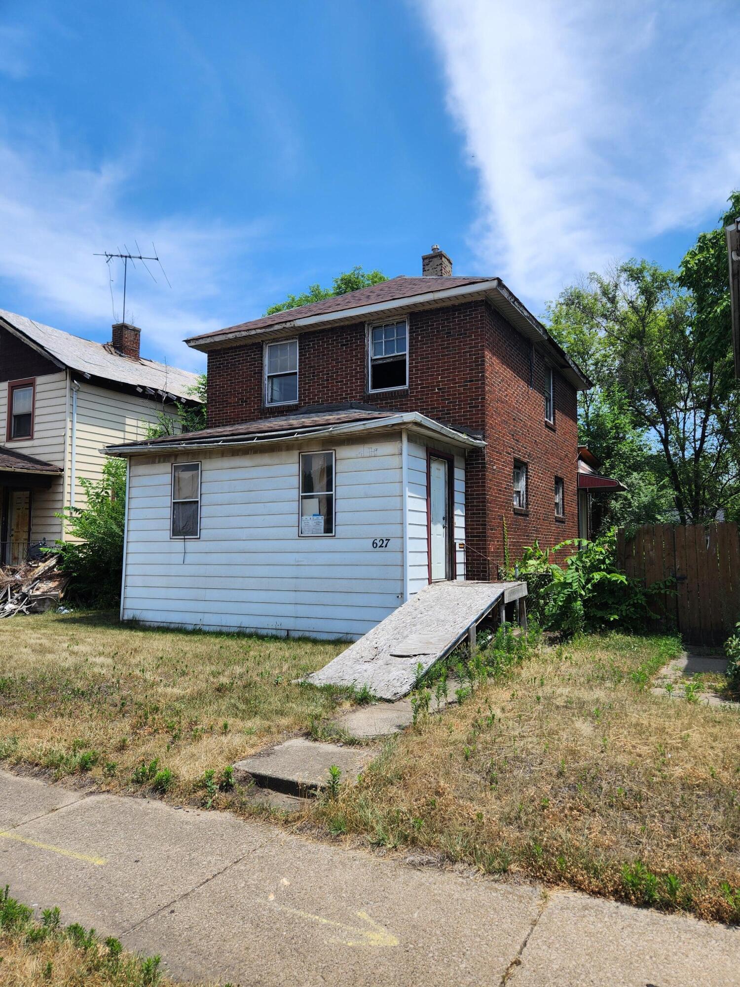 627 Tennessee Street Gary, IN 46402 - Photo 2 of 28 a view of a house with a backyard