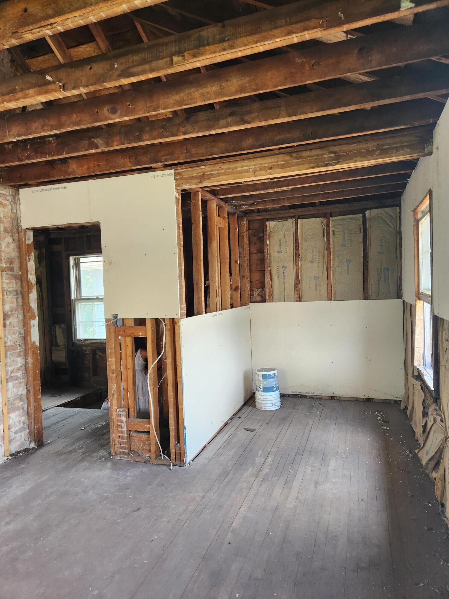627 Tennessee Street Gary, IN 46402 - Photo 8 of 28 a view of an empty room with wooden floor and a window