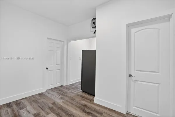 an empty room with wooden floor